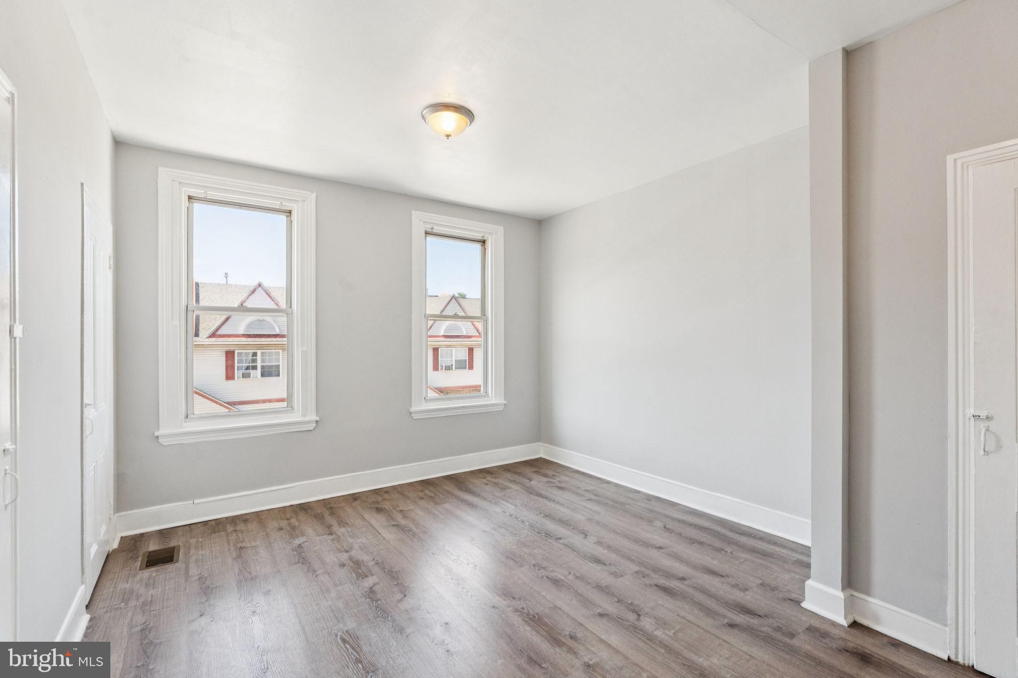 17 South 45th Street Philadelphia, PA 19104 - Photo 12 of 26 an empty room with wooden floor and windows