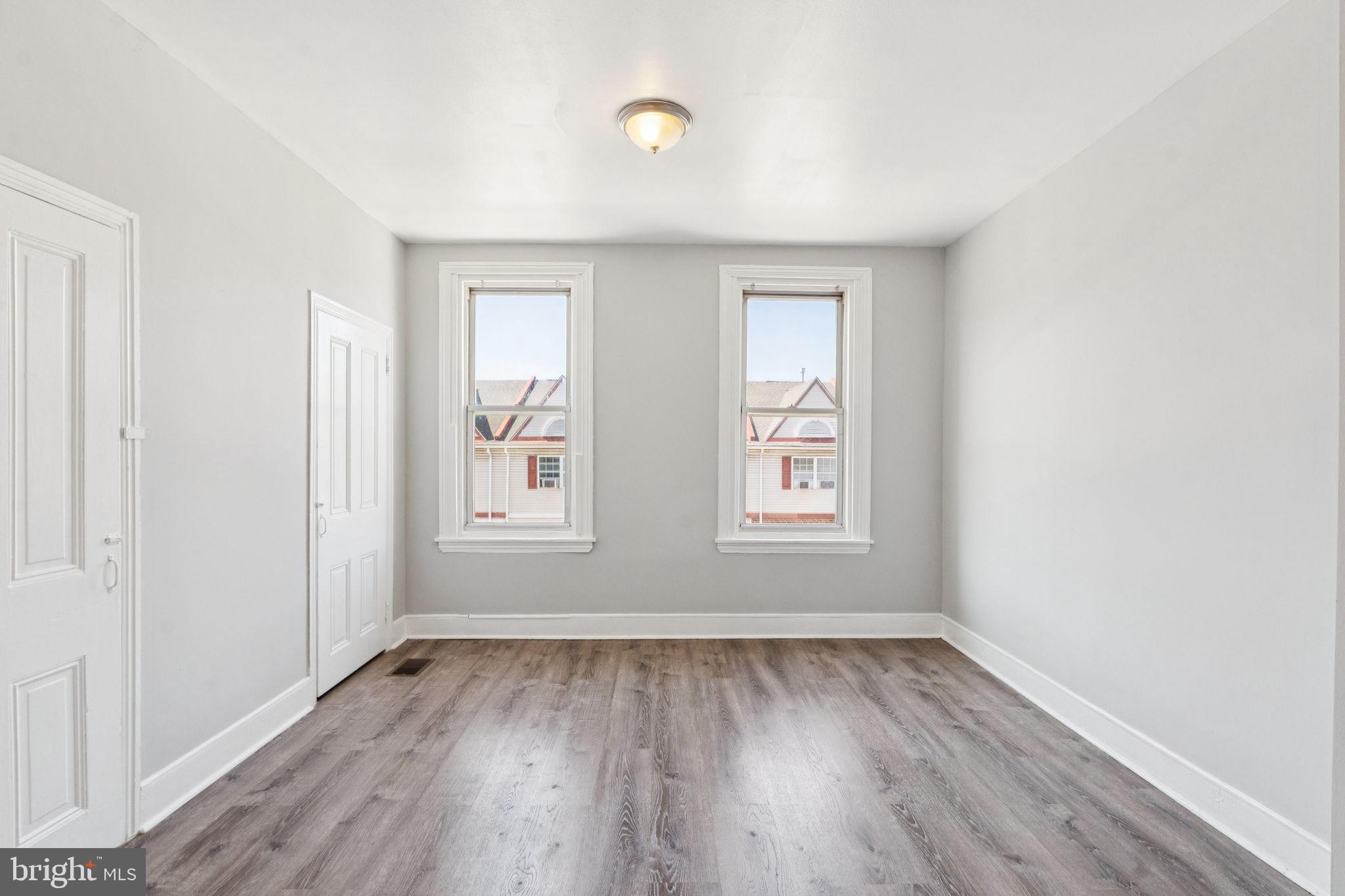 17 South 45th Street Philadelphia, PA 19104 - Photo 13 of 26 an empty room with wooden floor and windows