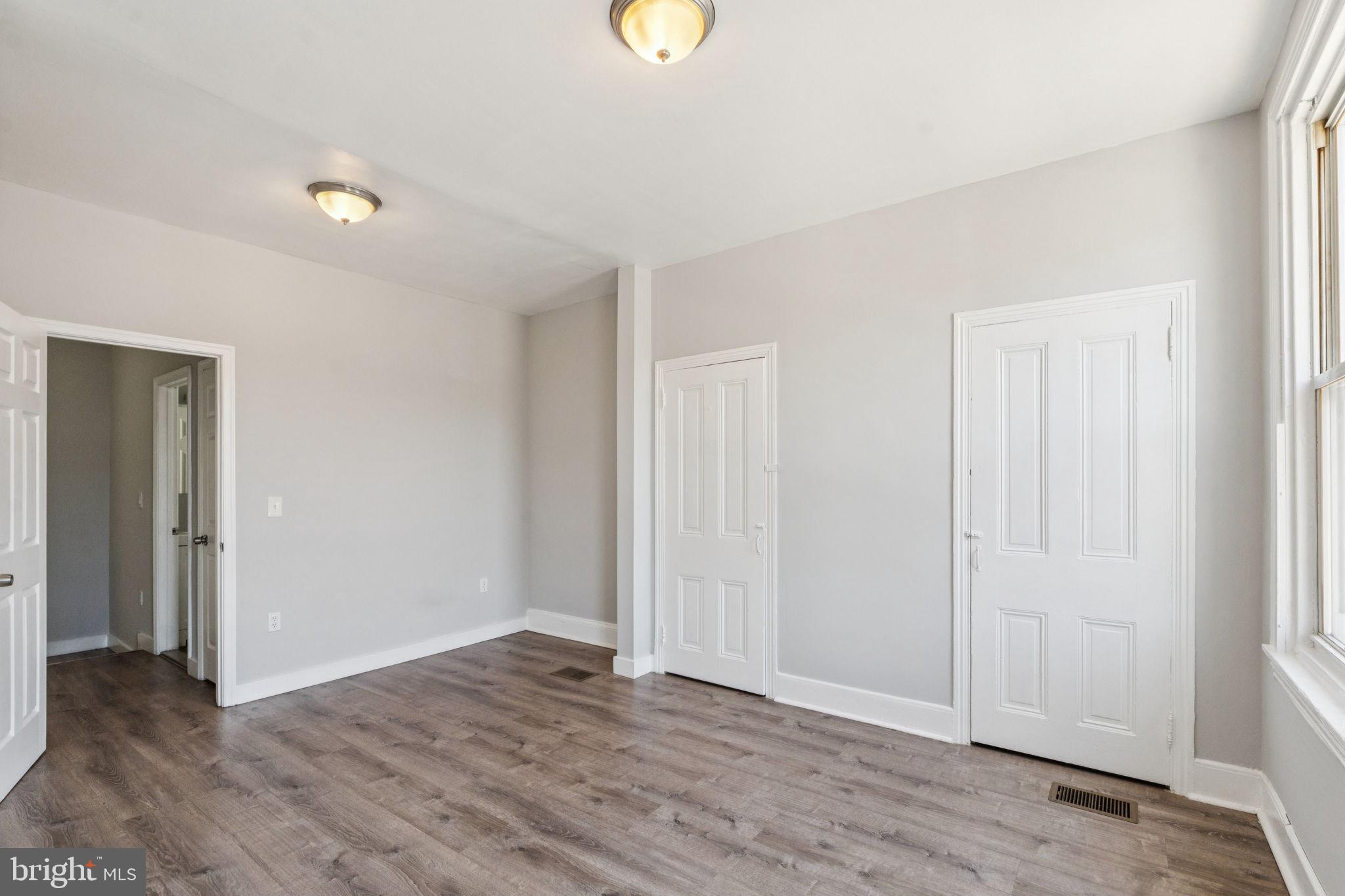 17 South 45th Street Philadelphia, PA 19104 - Photo 14 of 26 a view of an empty room with wooden floor and window