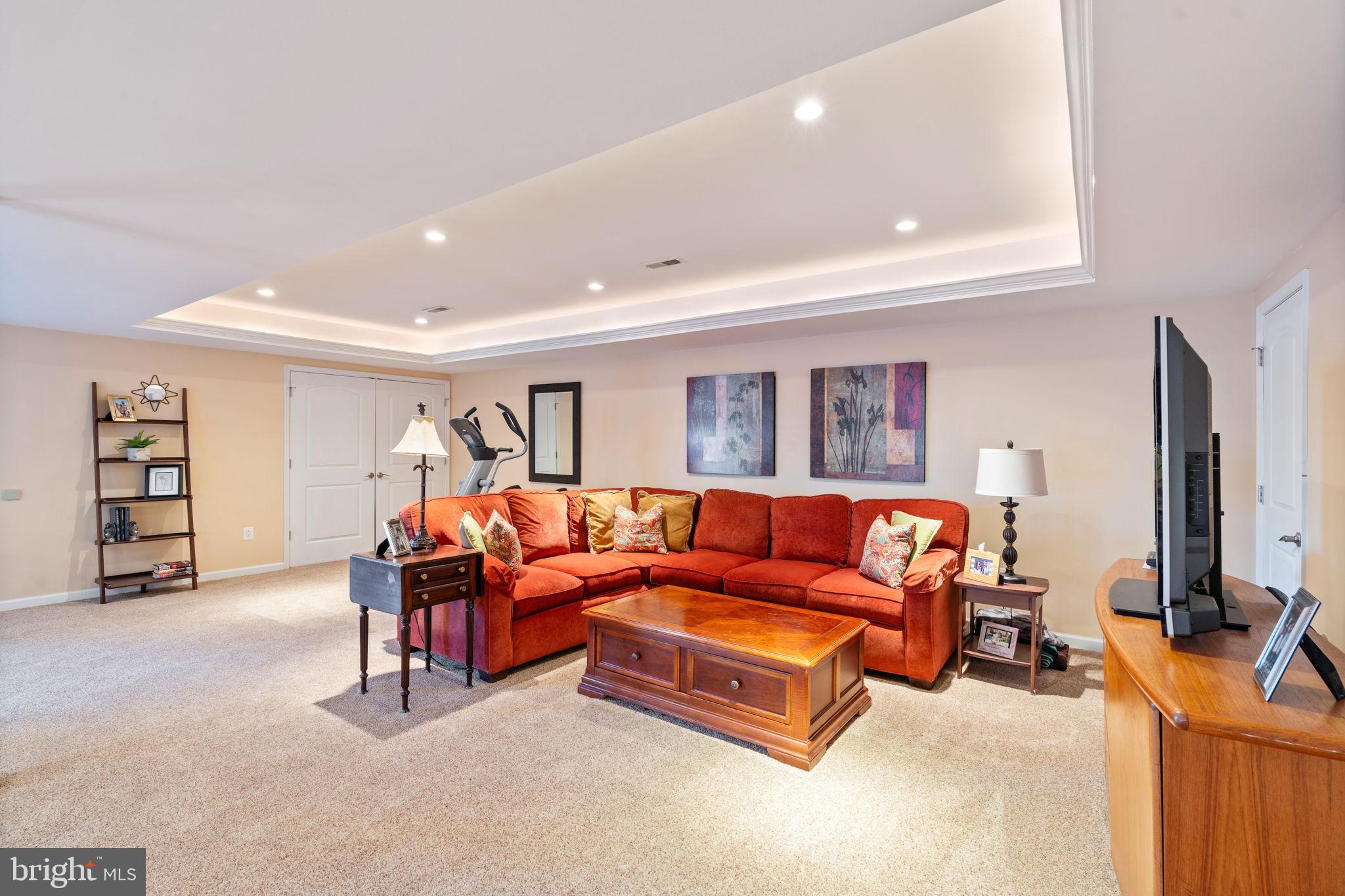 2104 Highland Ridge Drive Phoenix, MD 21131 - Photo 51 of 88 Wall to Wall Carpet in Rec Rm w/Tray Ceiling Light