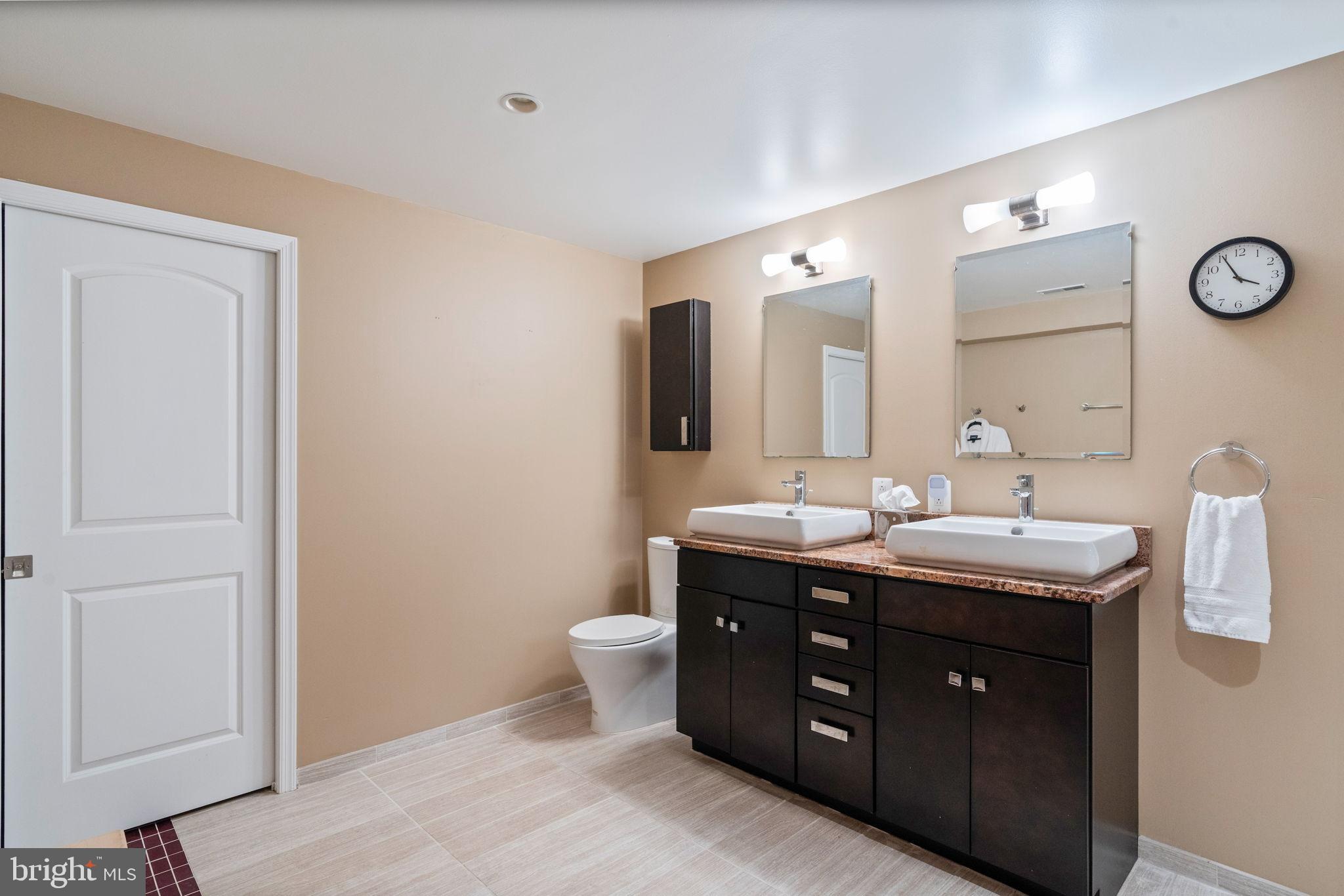 2104 Highland Ridge Drive Phoenix, MD 21131 - Photo 62 of 88 Dual-sink vanity w/modern lighting & mirrors
