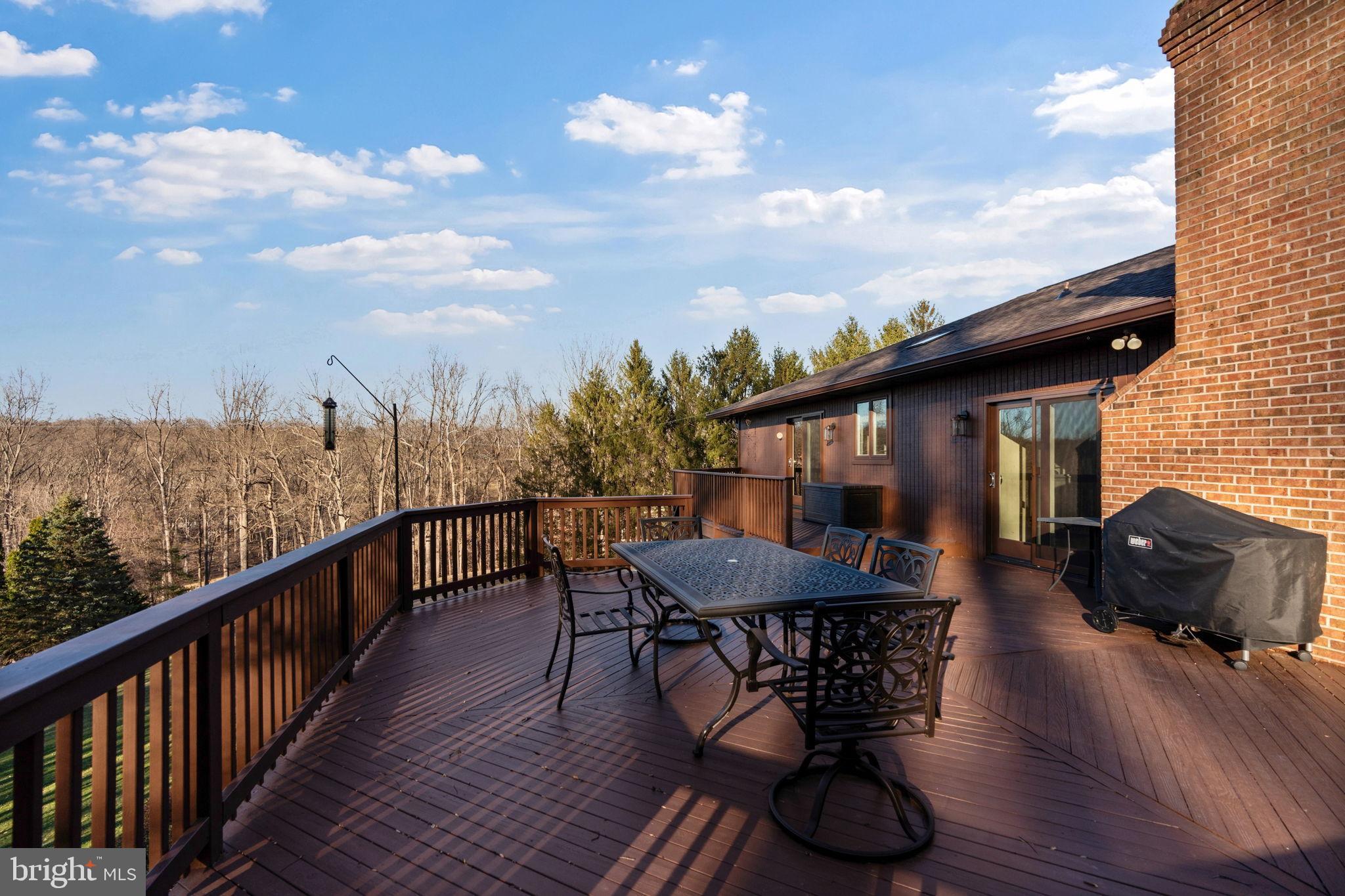 2104 Highland Ridge Drive Phoenix, MD 21131 - Photo 67 of 88 .Spacious deck with yard & woodland views.
