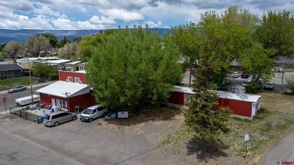 an aerial view of residential houses and car parked on street side