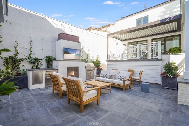 a view of a patio with couches and table and chairs