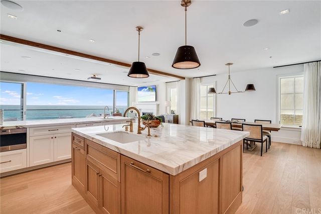 a living room with furniture a large window and a flat screen tv