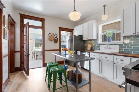 a kitchen with a sink stove and cabinets
