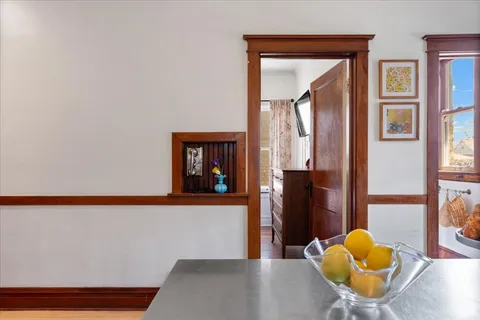 a dining room with furniture and window