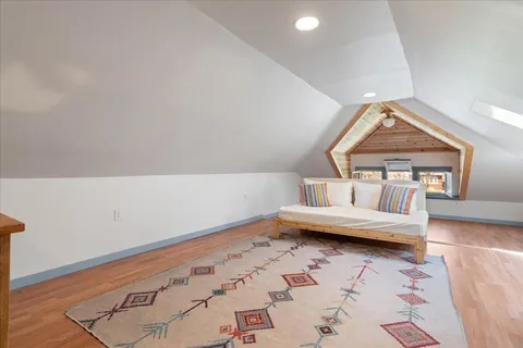 a view of a livingroom with furniture and wooden floor