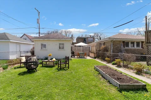 a patio with table and chairs