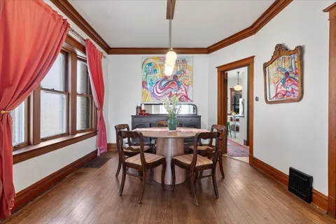 a dining room with furniture and window