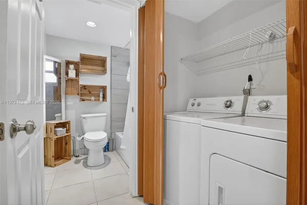 a utility room with dryer and washer