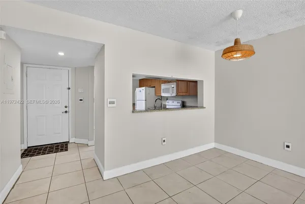 a view of a storage & utility room with a window