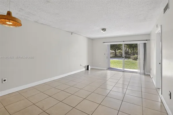 a view of an empty room and window