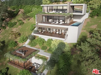 aerial view of a house with swimming pool and garden