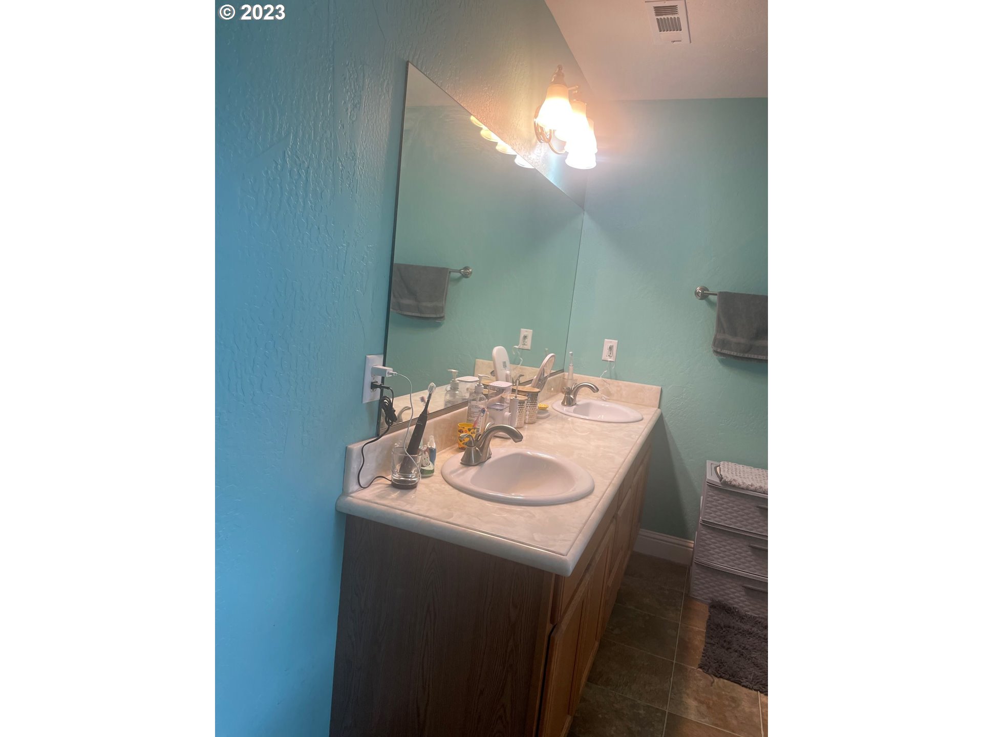 819 Easy Street, Unit 1 Brookings, OR 97415 - Photo 16 of 25 a bathroom with a sink and a mirror