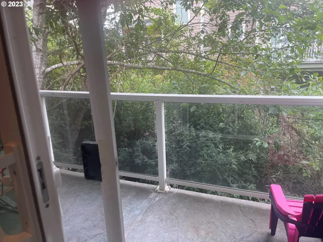 a view of a room with a large window