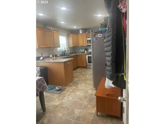 a kitchen with kitchen island cabinets and window