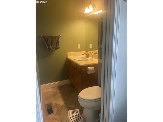 a bathroom with a toilet and a sink