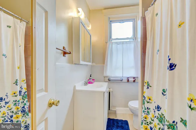a bathroom with a sink and a window