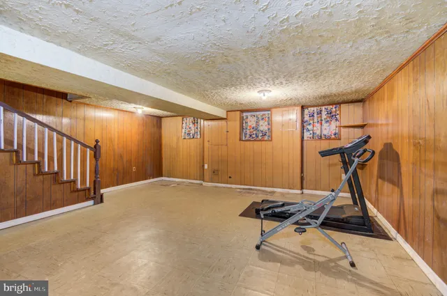 a view of a hallway with gym equipment