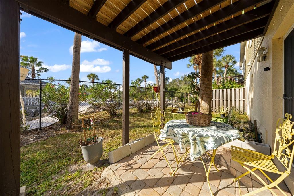 7641 Sailwinds Pass Port Richey, FL 34668 - Photo 30 of 59 a view of a porch with furniture and wooden floor
