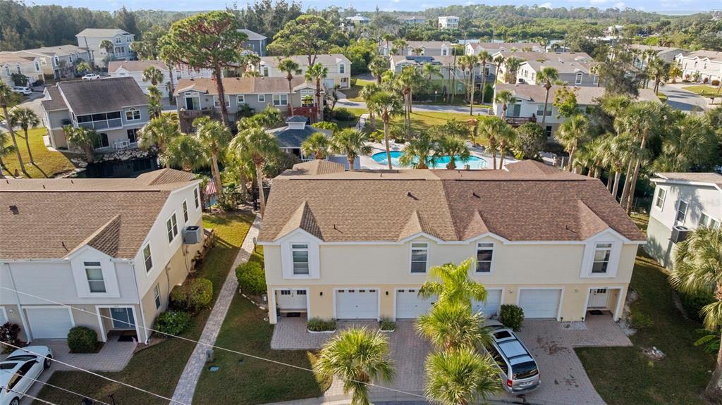 7641 Sailwinds Pass Port Richey, FL 34668 - Photo 34 of 59 an aerial view of residential houses with outdoor space and parking