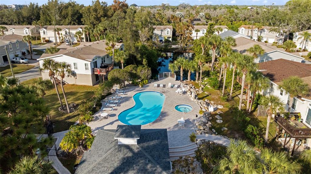 7641 Sailwinds Pass Port Richey, FL 34668 - Photo 48 of 59 a aerial view of a house with a swimming pool yard and outdoor seating