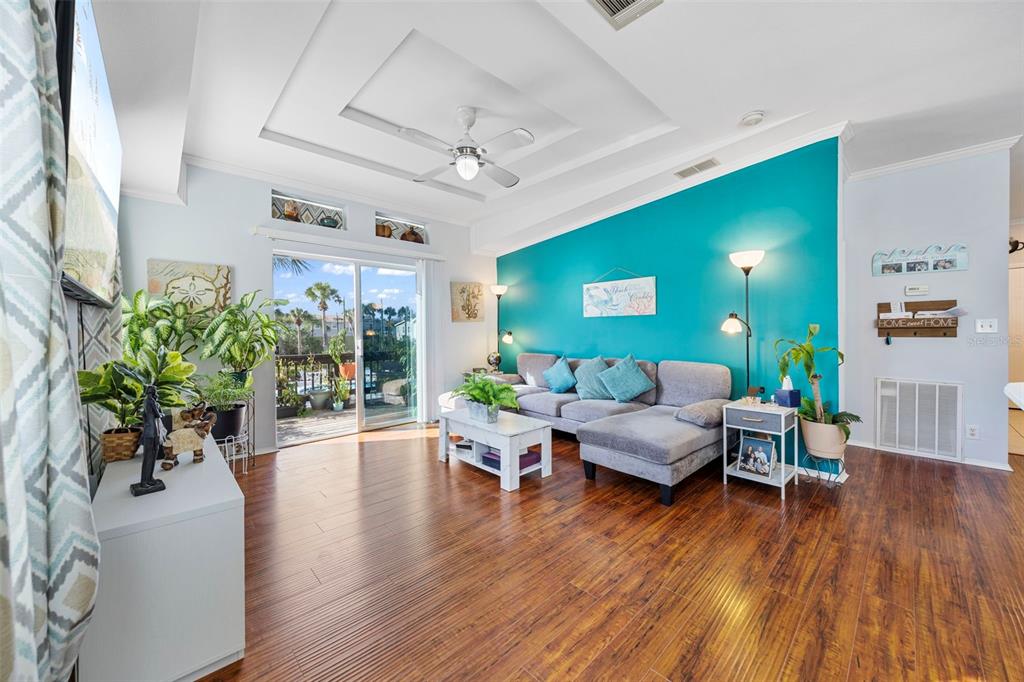 7641 Sailwinds Pass Port Richey, FL 34668 - Photo 7 of 59 a living room with furniture and a large window