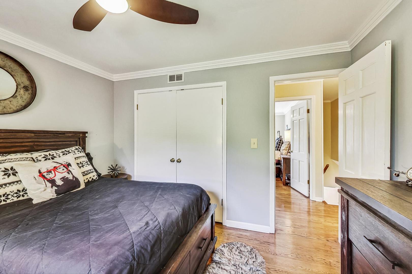 1 Knoll Ridge Road Rolling Meadows, IL 60008 - Photo 40 of 58 a bedroom with a bed and a walk in closet