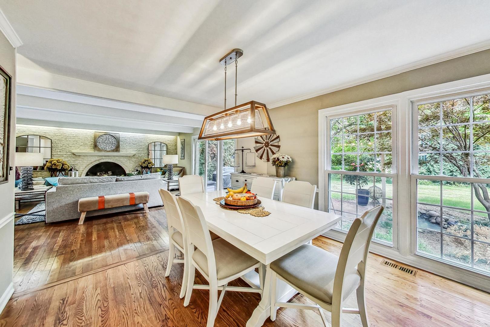 1 Knoll Ridge Road Rolling Meadows, IL 60008 - Photo 9 of 58 a view of a dining room with furniture window and wooden floor
