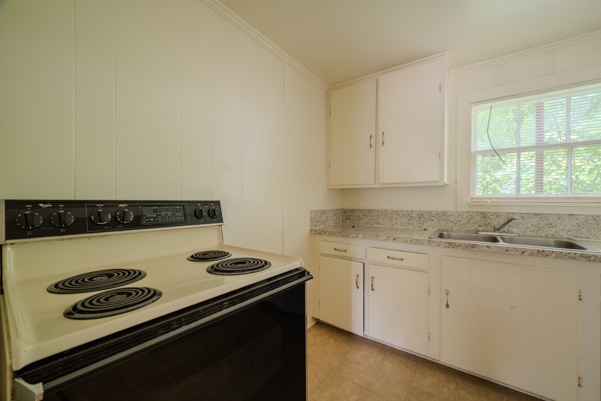 1005 Center Street Wharton, TX 77488 - Photo 12 of 33 a kitchen with a stove and a microwave