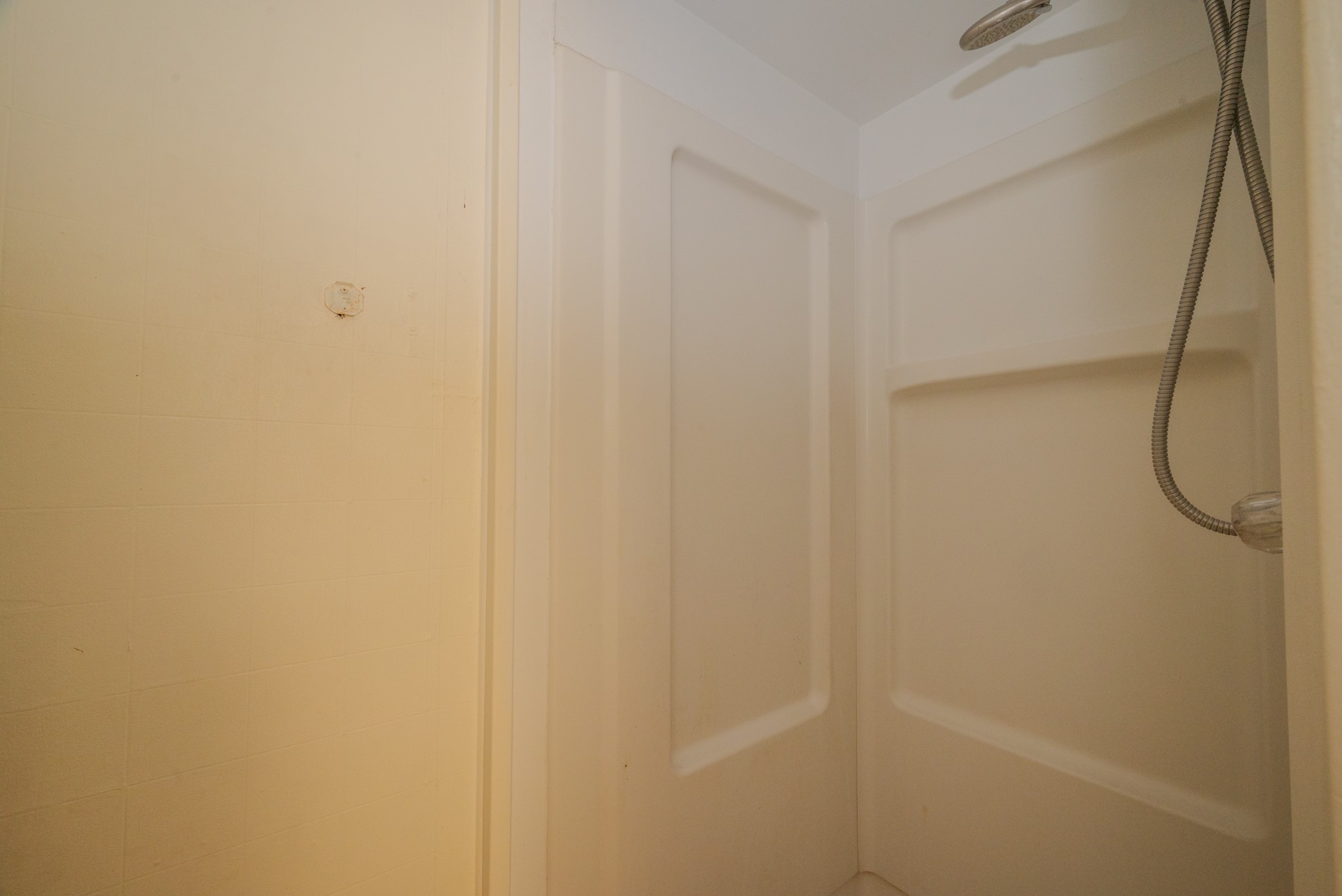 1005 Center Street Wharton, TX 77488 - Photo 19 of 33 a bathroom with a shower