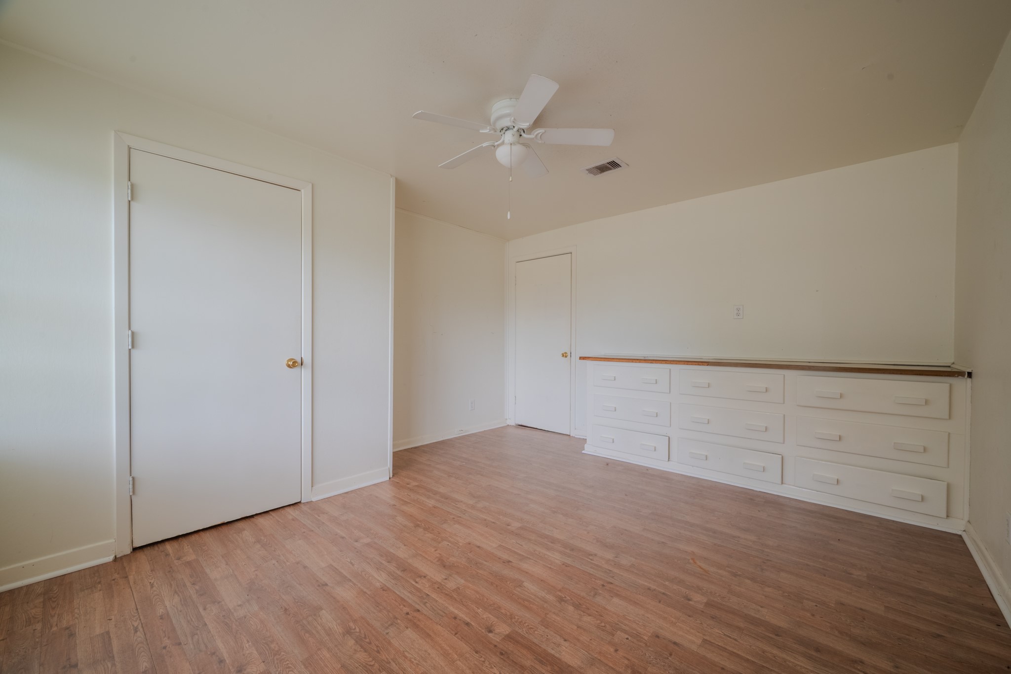 1005 Center Street Wharton, TX 77488 - Photo 21 of 33 a view of an empty room with wooden floor