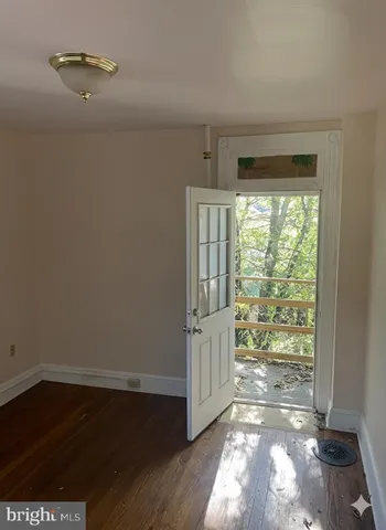 a view of entryway with wooden floor