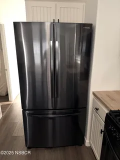 a view of a refrigerator in kitchen
