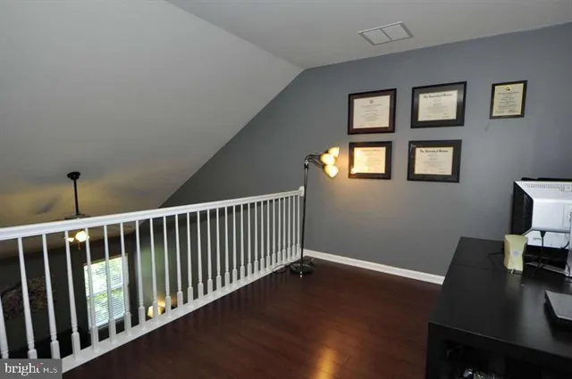 a view of a hallway with workspace