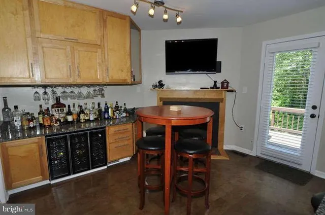 a kitchen with stainless steel appliances a stove a sink and a microwave