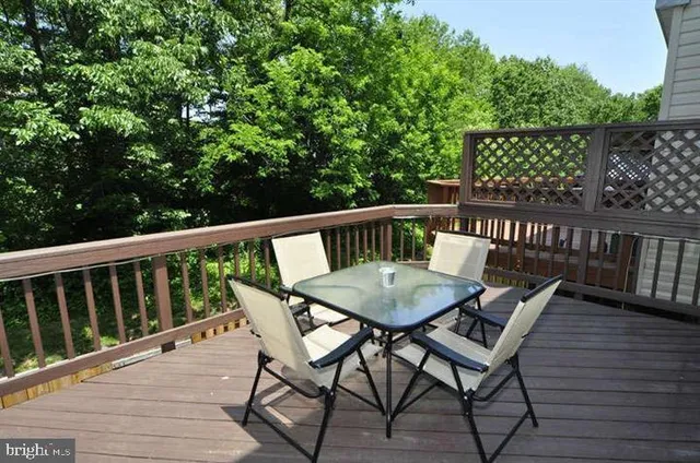 a view of balcony with furniture and wooden deck