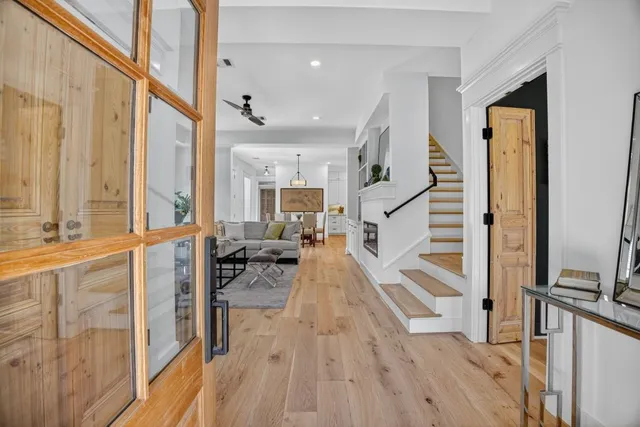 a view of living room with wooden floor and furniture