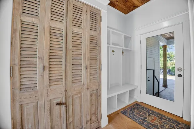 a view of a hallway with windows and stairs