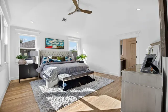 a view of a house with pool and chairs