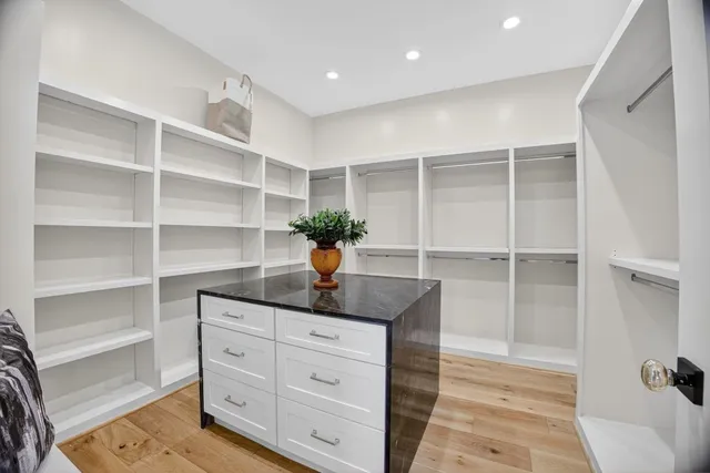 a picture of a bench in front of a white wall