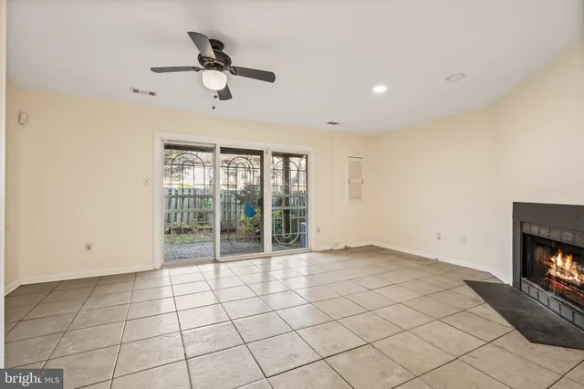 a view of an empty room and a window