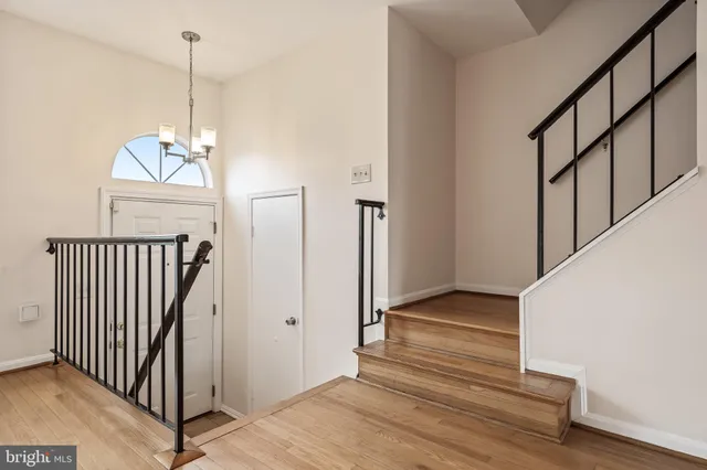 a view of balcony with chairs and wooden floor