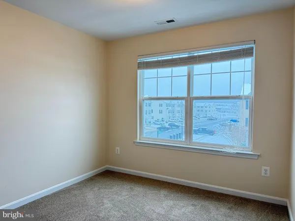 an empty room with wooden door