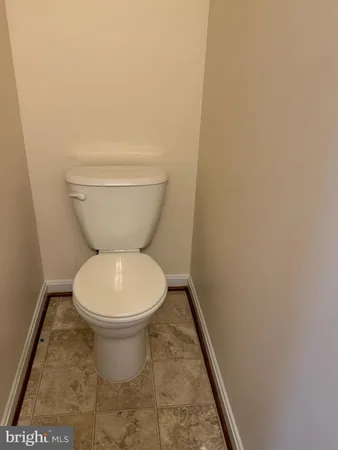 a bathroom with a sink vanity and a mirror
