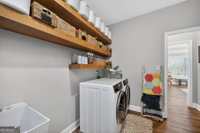 a view of storage and utility room with washer and dryer