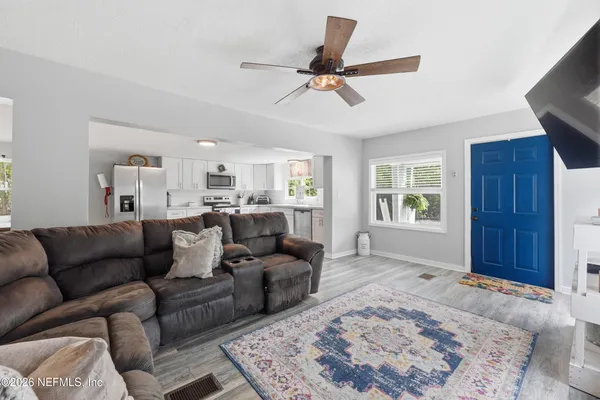a living room with furniture and a window