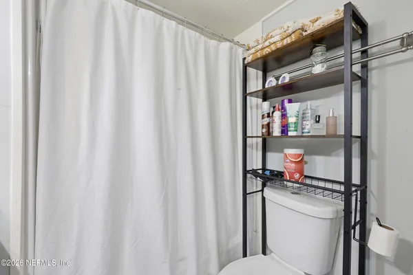 a room with a book shelf and a closet