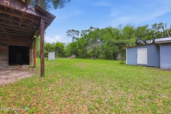 a backyard of a house with lots of green space